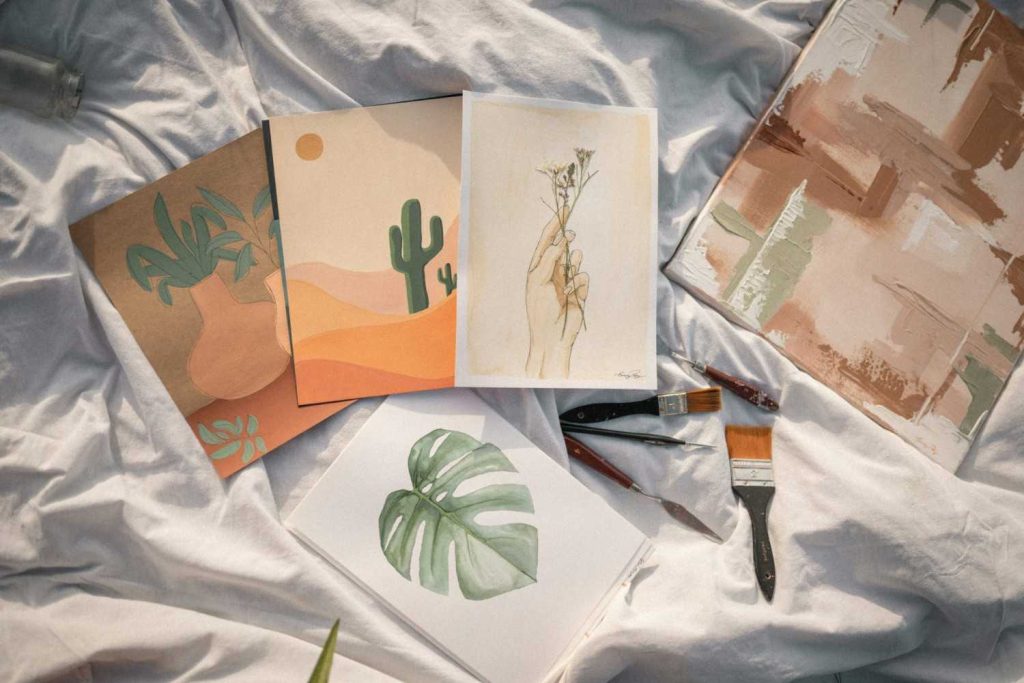 a table topped with lots of art supplies