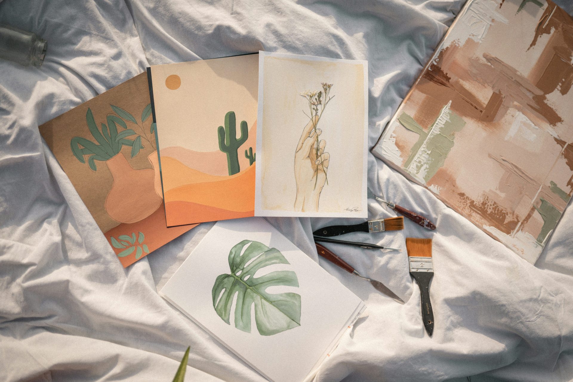 a table topped with lots of art supplies